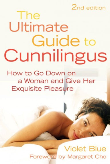 Book cover depicting a person in bed. Cover reads "2nd edition The Ultimate Guide to Cunnilingus How to Go Down on a Woman and Give Her Exquisite Pleasure Violet Blue Foreword by Margaret Cho"