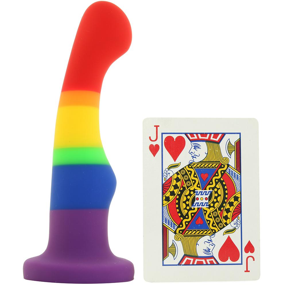 Freeedom dildo next to playing card for scale