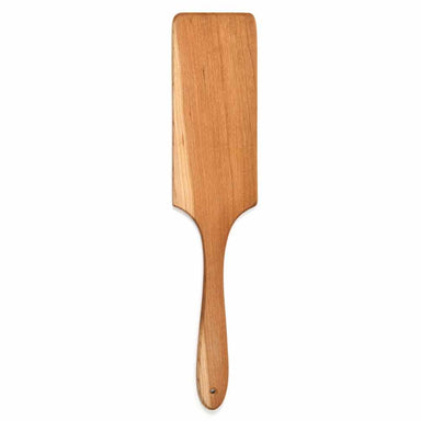 Wooden paddle on a white background 