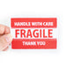 An embroidered red and white patch that says  "FRAGILE, Handle with Care, Thank You"