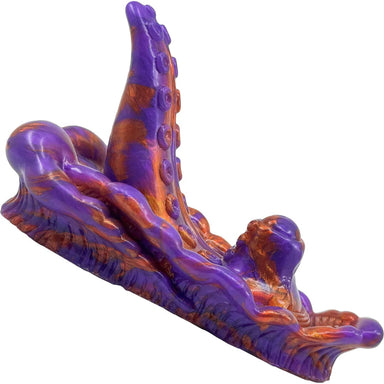 Purple and orange silicone grinding tentacle toy on a white background