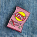 A pink sparkly bag of chips with the classic Lays logo, but it says Gays instead. The words Flaming Hot are at the bottom of the bag, with hot peppers and potato chip illustrations. 