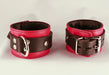 two red leather cuffs