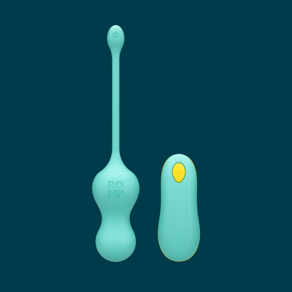 Teal egg vibrator with its remote on a navy blue background. 