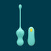 Teal egg vibrator with its remote on a navy blue background. 