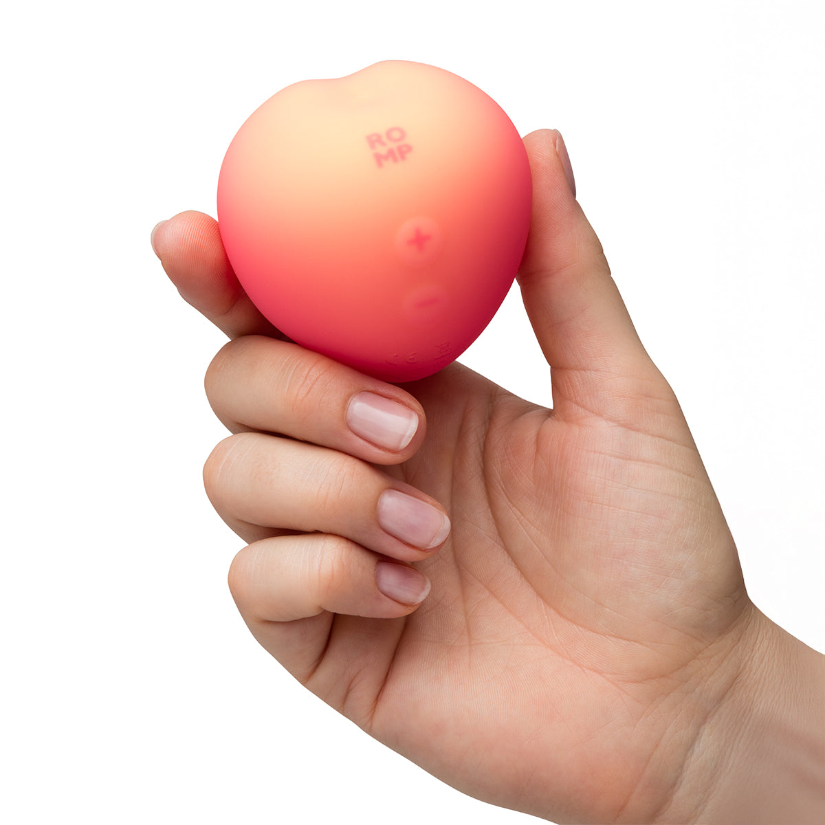 A hand holding up Romp Peach against a white background 