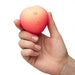 A hand holding up Romp Peach against a white background 