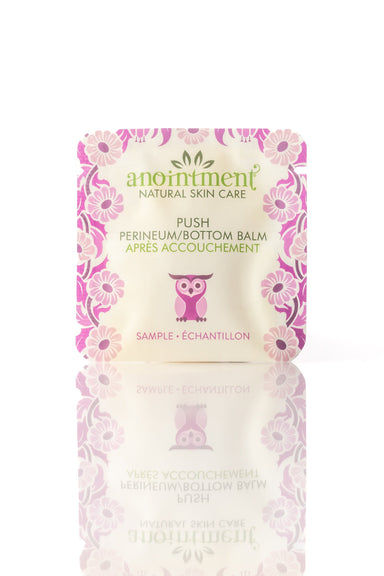 Sample package of anointment Perineum/Bottom Balm with floral design on a white background