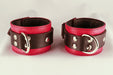 Red leather cuffs side by side