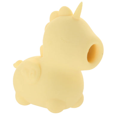 A yellow unicorn-shaped vibrator with simple design and an open hole where the mouth is. Inside the hole is a "tongue".