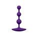 Purple silicone butt plug with 3 graduated beads on a white background