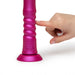 The ridged part of romp jiggle up close with a hand touching it.