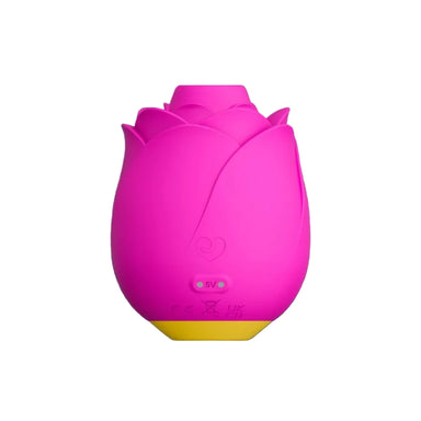 Pink rose shaped toy with a yellow base, from the back, showing the magnetic charging prongs 