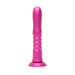 A pink thrusting vibrator on a white background