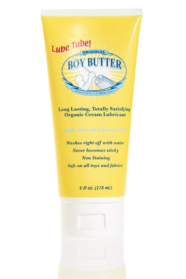 Boy Butter 6 ounce tube, it is yellow with a white flip cap, the logo shows a strong arm churning butter.
