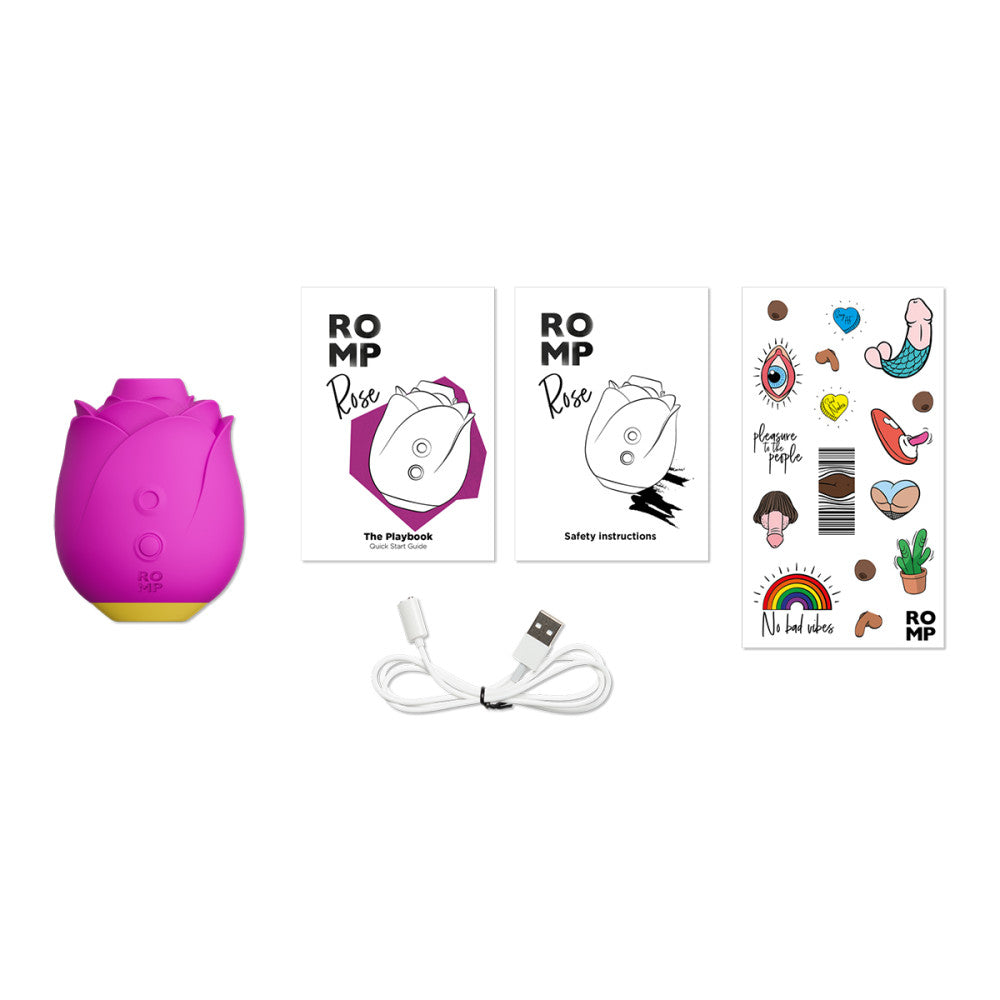 Contents of the Romp Rose packaging which includes charger chord, stickers, manual, and playbook