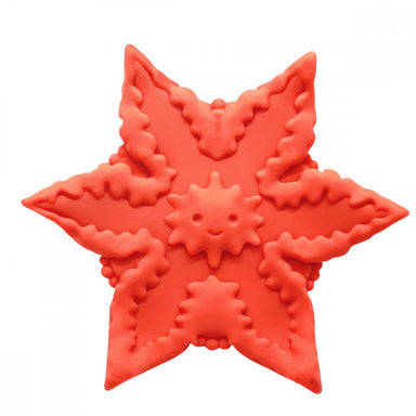 Orange starfish-shaped vibrator on white background