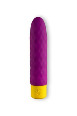 Purple and yellow sex toy in front of a white background