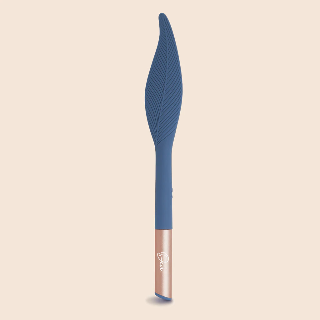 Blue feather vibrator on a peach background