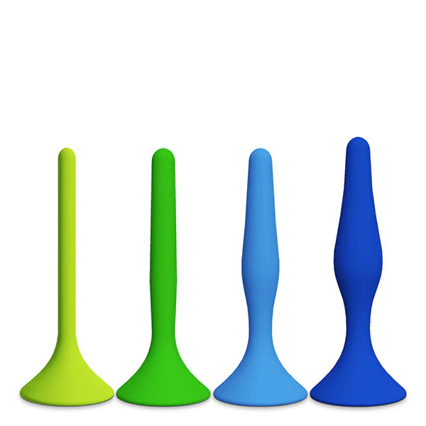 Four rectal dilators of varying size with flared bases standing up next to each other, from smallest to largest. They are all the same length, but they have different diameters.