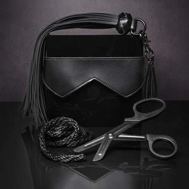 Four items from kit laid out on a dark background