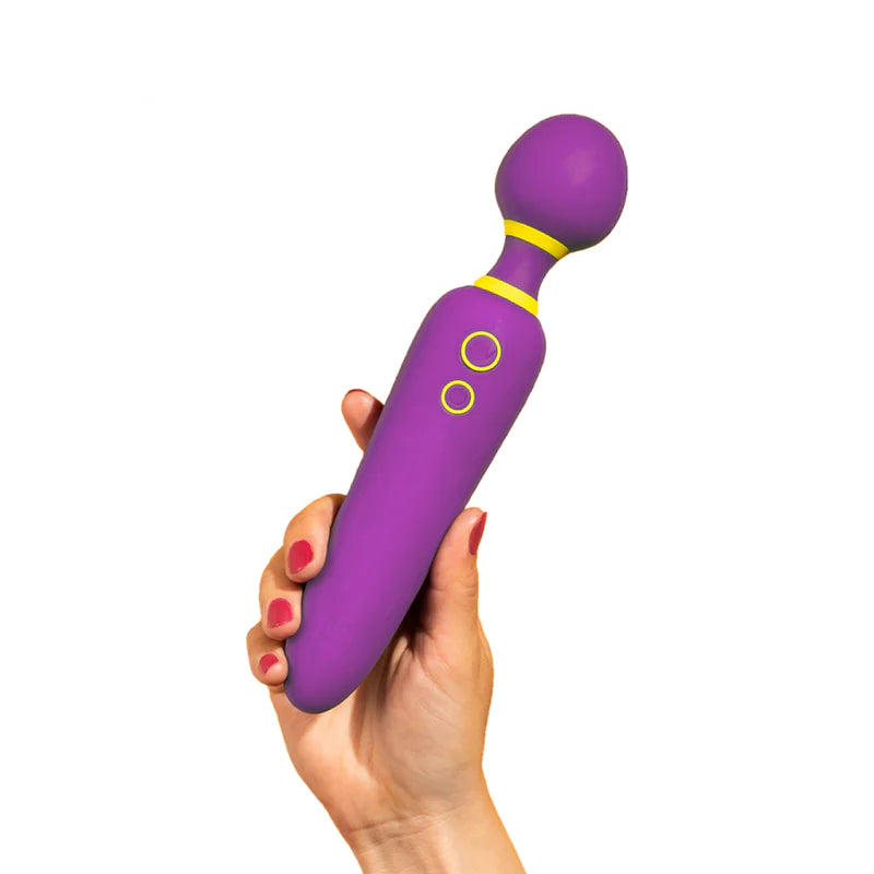 Hand holding a purple Romp Flip wand, against a white background
