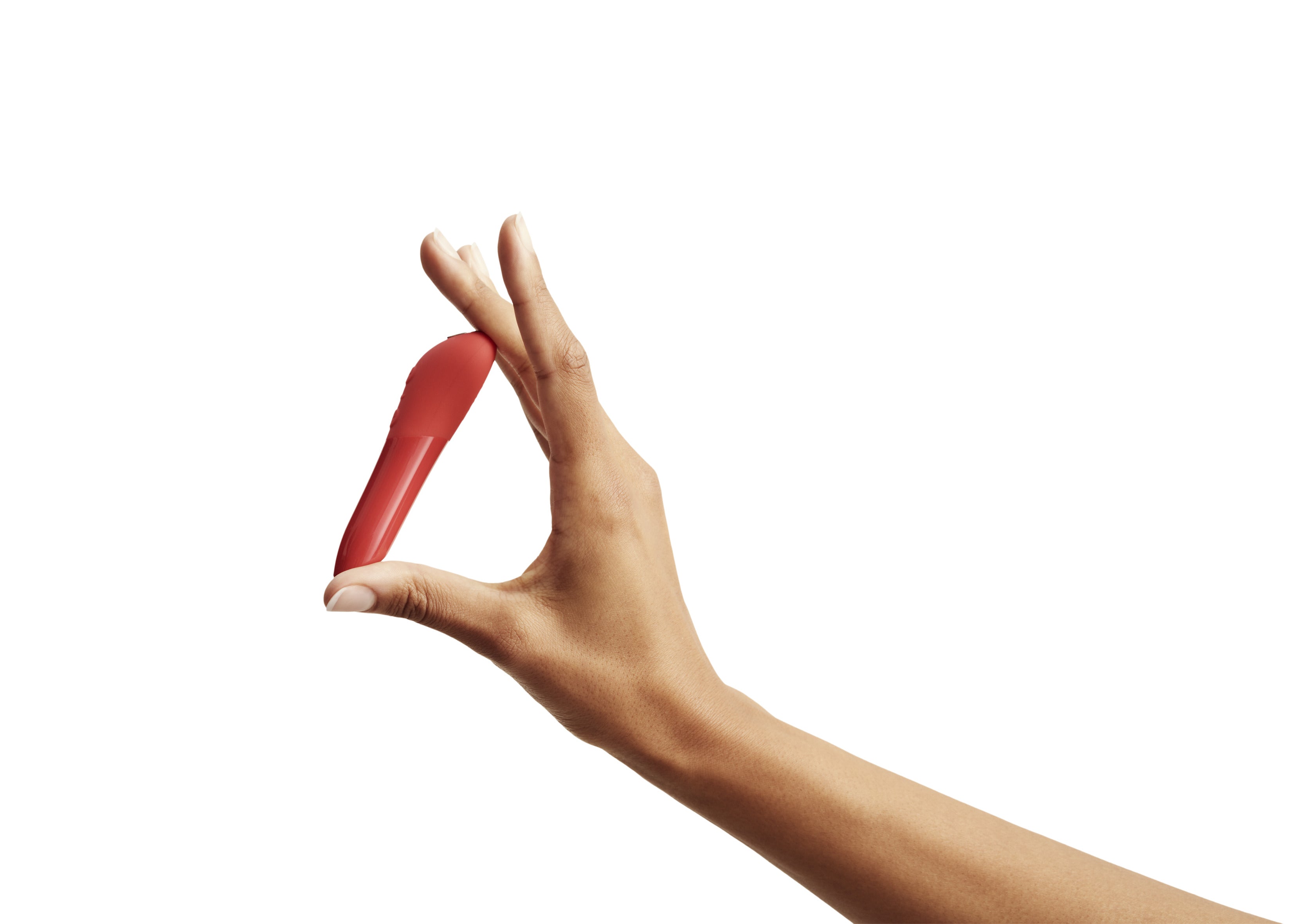 Red We-vibe tango being held in a hand