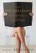 Book cover depicting a naked person with crossed legs reading a book that has "The sexy librarian's big book of erotica" written on the cover. Cover also reads "Edited by Rose Caraway"