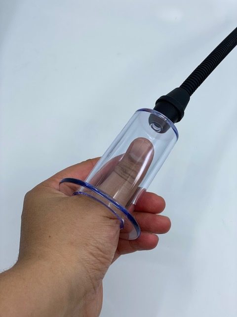 NYTC trans masc pump cylinder with thumb inserted